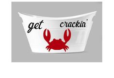 a white bucket with red crabs on it and the words get crackin '