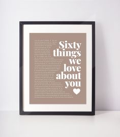 a framed poster with the words seventy things we love about you in white and brown