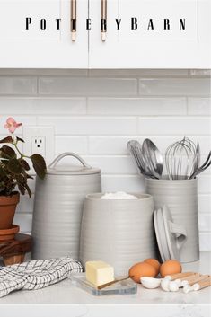 the kitchen counter is clean and ready to be used as cooking utensil holders