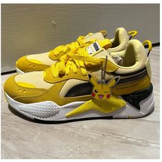 Pokemon X Puma - Picachu. New, Never Worn. Fits A Womens Size 7 - Youth 5.5. Has Removable Picachu Keychain. Yellow Sporty Sneakers With Puma Logo, Sporty Yellow Puma Sneakers, Sporty Yellow Sneakers With Puma Logo, Yellow Low-top Puma Sneakers, Yellow Lace-up Puma Sneakers, Playful Yellow Sneakers With Round Toe, Playful Yellow Lace-up Sneakers, Pokemon Shoes, Puma Shoes