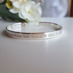 Losing a dog or a cat is very painful and leaves us with an emptiness in our hearts. There is nothing nicer that showing the person who has lost their pet that you really care. ► Sterling Silver 925 personalised bracelet with unique engraving!  ► You don't have to count characters. One price for any length (max around 60 characters on each side)! ► Sizing Availability: up to 7" (18cm) ► Deep engraving! ► Every bracelet gets finished by hand. ► Our production is not outsourced. Every step of prod Silver Engraved Bracelet For Memorial, Silver Paw Print Jewelry As Gift, Sterling Silver Jewelry With Paw Print, Sterling Silver Paw Print Jewelry Gift, Personalized Silver Jewelry With Paw Print, Animal Bracelet, Pet Remembrance, Memorial Bracelet, Remembrance Gifts