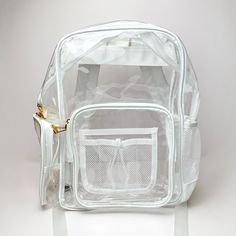 Pictured on a white background is a clear backpack with a white outline, white mesh pockets, and gold hardware. White Nylon Backpack For School, White Everyday Backpack For Back To School, White Backpack With Adjustable Strap For Students, Back To School Travel Backpack With Clear Strap, White Travel Backpack, White Rectangular Backpack For Everyday Use, White Backpack For Back To School, White School Backpack With Adjustable Strap, White Satchel Backpack For School