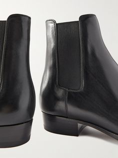 SAINT LAURENT revisits its signature 'Wyatt' boots in so many new colourways and fabrications each season, but this versatile black leather pair is perhaps the wisest investment. They've been impeccably made in Italy with elasticated side panels and are set on Cuban heels. They break at the perfect height to wear with the brand's skinny-fit jeans or tailored trousers. Saint Laurent Collection, Chelsea Boots For Men, Brown Chelsea Boots, Cuban Heels, Chelsea Boots Men, Boots For Men, Black Chelsea Boots, Saint Laurent Shoes, Leather Chelsea Boots