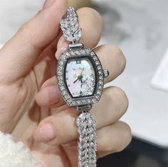 Description & Details Adorn your wrist with the Vincent van Gogh's Roses crystal watch. Featuring a delicate 3D floral design on a mother-of-pearl dial, surrounded by sparkling crystals, this watch is a true symbol of elegance. Ideal for any occasion. • Material: High Quality Copper ∙ Cubic Zirconia ∙ Mother of Pearl• Movement: Swiss ETA Quartz, Water Resistant to 30 Meters• Dimensions: 22.5 mm case, 9 mm wide strap• All our work is custom made by hand with love Diamond White Watches With Rhinestones For Gift, Gift Watches With Crystal And Rhinestones, Silver Diamond Watch With Rhinestones And Crystal, Diamond White Watch With Rhinestones As Gift, Diamond White Rhinestone Watch For Gift, Rose Gold Diamond Watch With Rhinestones For Gift, Elegant Round Diamond Watch With Crystal Accents, Silver Cubic Zirconia Watch As Gift, Elegant Round Diamond Watch With Crystal