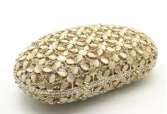 Description: The NUHA Clutch is the perfect way to add a touch of elegance to any special occasion. Crafted with sparkling crystals, this stunning clutch will add a glamorous statement to any outfit. Make a statement with the NUHA Clutch. Lining Material: Synthetic Leather Detachable Chain Included Approximate Size: 15-1/2cm (L) x 5cm (W) x 10cm (H) Crystal Clutch, Sparkling Crystal, Synthetic Leather, Special Occasion, Sparkle, Chain, Crystals, Leather