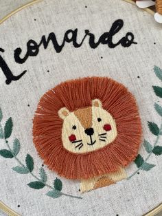 a close up of a embroidery on a piece of cloth