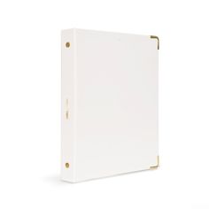 a white binder on a white background with gold trim around the edges and sides