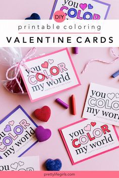 valentine's day card with hearts and crayons next to it on a pink background