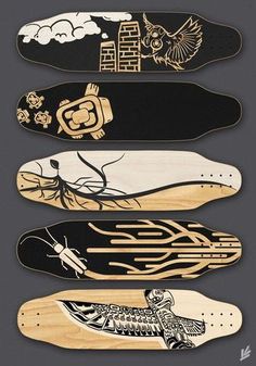 four skateboards with different designs on them