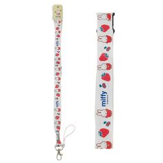 two lanyards with cartoon characters on them, one is white and the other has red