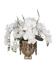 a vase with white flowers and greenery in it on a white background for decoration