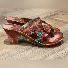 New Elite By Corkys Havana Slip On Toe Loop Floral Brown Sandal Size 7 Nwot / Nwob Step Into Warm Weather Style With The Help Of These Fun And Colorful "Summer" Sandals From Corky's Elite. Featuring A Leather Upper Decorated With Hand-Painted Floral And Leaf Designs, These Sandals Go Great With All Your Favorite Casual Summer Looks. Has A Padded Footbed Keeps You Comfy And Kicking. 3” Heel Hand-Painted / Floral / Embroidered / Bright / Statement / Travel / Summer / Beach / Vacation / Resort / Re Traditional Multicolor Spring Heels, Traditional Multicolor Heels For Spring, Brown Bohemian Heels For Spring, Bohemian Brown Heels For Spring, Bohemian Open Toe Heels, Brown Sandals For Festival, Bohemian Multicolor Open Toe Heels, Bohemian Heels For Vacation, Multicolor Leather Bohemian Heels