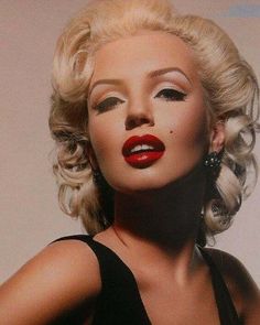 a woman with blonde hair and red lipstick