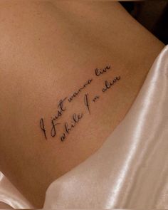 the back of a woman's shoulder with writing on it that says, i love you