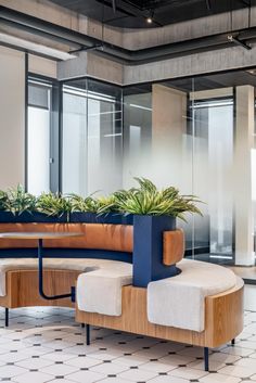 a bench with plants on it in an office