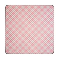 a pink and white checkered placemat on a white tablecloth with black trim