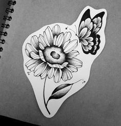 a drawing of a sunflower and butterfly on a piece of paper with black ink