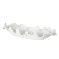 a large white bowl with wavy shapes on it's sides, sitting in front of a white background