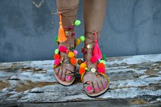 Multicolor tie up boho   leather sandals  embellished in pink ,yellow,green,orange pom poms and charms .Colourful and happy for all day long. Ideal for a perfect bohemian style. ♕ Designed to hold feet with minimal coverage and maximum stability ☀ Authentic Greek handmade ☆ Vegetable - tanned vachetta leather insole ☆ Anti-slip Italian SVIG sole ☆ Genuine leather straps ☆ Extremely flexible & lightweight - easy to walk ☆ An awesome Shoe-Box  All of our sandals are handmade in Greece in our works Bohemian Flat Lace-up Sandals For Beach, Pink Round Toe Lace-up Sandals For Beach, Pink Open Toe Lace-up Sandals For Beach, Bohemian Lace-up Sandals For Summer Party, Summer Party Lace-up Open Toe Sandals, Bohemian Adjustable Flat Lace-up Sandals, Bohemian Open Toe Sandals For Summer, Spring Vacation Tassel Sandals, Colorful Open Toe Sandals For Summer