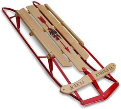 a wooden sled with two red handles