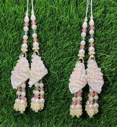 Indian Handmade White pink Latkan for Saree Blouse Lehenga HandBags Dupatta Decoration Bridal Wedding dress for Women pair of 2 pcs Size - 16.0 cm Length  Item Description You can use this Beautiful pair of tassle for several DIY projects.  *These beautiful Tassel Latkans are used as the accessory for saree blouse on the back, but u can use according to your need and your innovative ideas. * Package contains 2 Latkan / 1 Pair Other Than Saree Blouse, you can use these latkans in various ways Craft Projects Designing Home Decoration Festive celebrations. Evening and party Apparels. Home décor items Apparel & Fashion Scarves n Stoles Headband, hats Table cover, curtains, Pillow covers, Cushion cover Shoe designing Headband, hats Table cover, curtains Designing stylish blouses Ship From New D Elegant Pink Sets For Puja, Pink Traditional Wear With Latkans For Puja, Elegant Pink Choli For Puja, Pink Traditional Wear With Latkans And Traditional Drape, Pink Traditional Wear With Latkans, Pink Bollywood Tikka For Party, Festive Pink Tikka For Party, Festive Pink Party Tikka, Traditional Pink Choli With Handwork