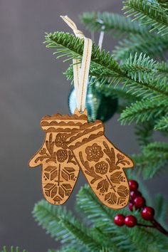 a wooden ornament hanging from a christmas tree