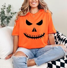 Halloween Boo Shirt, Fall Shirt, Halloween Pumpkin Shirt, Jack-O-Lantern Shirt, Love Boo Shirt, Cool Halloween Shirt, Spooky Tee, Pumpkin Face Shirt HOW TO ORDER: 1. Please, Check and Review all Photos and Size Charts (The V-necks and Tank Tops are Women's Size, and the other styles are Unisex) 2. Choose Your T-Shirt Color/Size (You can see youth and toddler options in the same drop-down menu) 3. Choose Your Quantity as much as you want. 4. Click "Add To Cart". For multiple items go back to the listing and repeat the steps. *T-SHIRTS QUALITY: The T-Shirts are relax fitted. Black, Navy and White t-shirts are 100% cotton. Other colors are cotton/poly blend. Sweatshirts are 50/50 cotton/polyester. * PROCESSING & SHIPPING: Processing is 1-2 days. First Class Shipping is 2-5 business days (afte Shirt Halloween Costumes, Boo Shirts, Pumpkin Face, White T Shirts, Pumpkin Shirt, Pumpkin Faces, Costumes Halloween, Fall Shirt, Halloween Tees