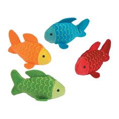 four colorful plastic fish on a white background