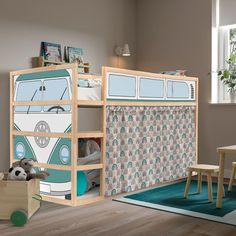 a child's room with a bunk bed, desk and chair in it that has a vw bus on the side