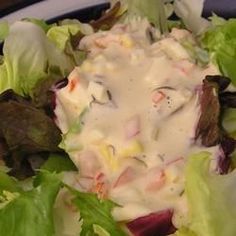 a close up of a salad with dressing on it