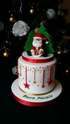 a christmas cake with santa clause on top