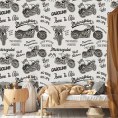 a bedroom with a bed, chair and wallpaper that has motorcycles written on it