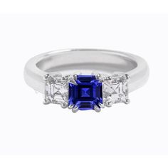 METAL SPECIFICATIONS White Gold 14K STONE SPECIFICATIONS Stone Name : Blue Sapphire and Diamond Stone Cut : Asscher Stone Details : There is one asscher cut sapphire approx. 1 carat (Approx. Size 5 x 5 mm) and two asscher diamonds approx. 0.75 carats each (Approx. Size 5.7 x 3.7 mm) on the sides. Natural earth mined stones. Color : F Clarity : VS1 Quality of Sapphire : AAA Total : Approx. 2.50 Carats RING SPECIFICATIONS Size : 6.5 (Can ship in any size, please send us a message about size after Asscher Diamond, Ceylon Sapphire, Three Stone Ring, Asscher Cut, Sapphire Diamond Ring, Three Stone Rings, Natural Earth, Stone Cuts, Sapphire Diamond