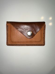 This rustic handcrafted wallet is made of high quality leather and slim enough to fit in your pocket with ease. Whether you're a minimalist or someone looking for a unique wallet, this can make a great option. Also, makes for a great gift for men during the holidays.  Features: -Handcrafted with high quality leather -Holds up to 5 credit cards, ID cards, drivers license, and folded cash -Slim & Minimalist  -Unique design -Added button for security Dimensions- 4.625L x 2.875H x .375W (inches)                        117.475L x 73.025H x 9.525W (mm) Follow my Instagram for updates! Instagram: @deadsailorleather Leather Card Holder With Waxed Finish As Gift, Minimalist Leather Trifold Wallet Gift, Minimalist Brown Card Holder With Coin Pocket, Minimalist Brown Trifold Wallet, Minimalist Brown Wallets As Gift, Minimalist Brown Trifold Wallet For Everyday, Handmade Minimalist Brown Wallet, Brown Minimalist Card Holder For Gift, Minimalist Card