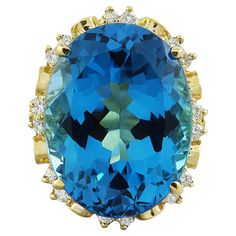 30.50 Carat Natural Topaz 14 Karat Solid Yellow Gold Diamond Ring Stamped: 14K Total Ring Weight: 15 Grams Topaz Weight 30.00 Carat (22.00x16.00 Millimeters) Diamond Weight: 0.50 carat (F-G Color, VS2-SI1 Clarity ) Face Measures: 25.00x20.15 Millimeter SKU: [600666] Luxury Yellow Gold Rings With Blue Topaz, Luxury Faceted Yellow Gold Sapphire Ring, Topaz Yellow, Yellow Gold Diamond Ring, Gold Diamond Ring, La Face, Gold Diamond Rings, Solid Yellow, Yellow Gold Rings