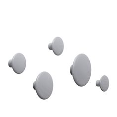 four white round knobs on a white background