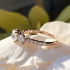 a close up of a ring on top of a flower