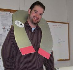 a man is wearing a paper mache costume