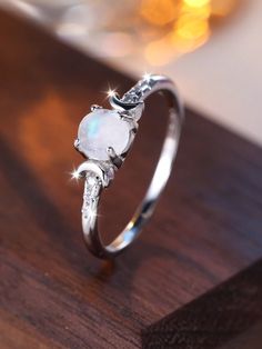 a white ring sitting on top of a wooden table