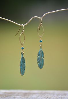 Brass feather earrings with beads, long bohemian dangles, green patina Green Bohemian Earrings With Patina, Green Patina Bohemian Earrings, Green Bohemian Patina Earrings, Bohemian Green Patina Earrings, Green Bohemian Earrings With Feathers, Green Bohemian Feather Earrings, Bohemian Green Feather Earrings, Earrings Handmade Beaded, Dangle Beaded Earrings