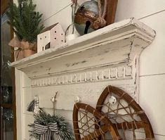 a white shelf with some ornaments on top of it