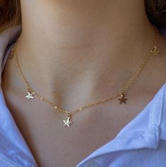 This sweet little necklace would make the perfect gift. Five tiny little 14kt gold filled stars dangle from the 14kt gold filled fine cable chain.    Each star is hammered with a dappled texture to catch the light beautifully.  The length of the chain is 16.5” and is finished with a spring ring clasp and my signature large end ring. Everyday Gold Threader Earrings With Adjustable Chain, Trendy Gold Threader Earrings For Everyday, Gold 14k Gold-filled Threader Earrings With Adjustable Chain, Gold Threader Earrings With Delicate Chain For Everyday, Everyday 14k Gold Filled Threader Earrings With Delicate Chain, Delicate Gold Threader Earrings With Adjustable Chain, Nickel-free 14k Gold-filled Gold Threader Earrings, 14k Gold Filled Threader Earrings For Everyday, Minimalist Gold Threader Earrings With Adjustable Chain