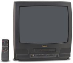 an old television and remote control sitting next to each other in front of a white background