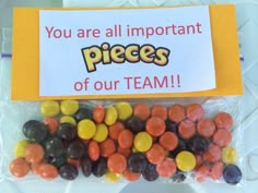 there is a bag with candy in it that says you are all important pieces of our team