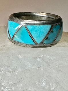 "Zuni ring Turquoise wedding band size 4.25  sterling silver women   Size  4.25 Between a size 4.25 and a size 4.50  Weight  6.2g  Width   3/8\" Free Shipping & Free/4 Postal Insurance  Delivered in a Gift Box  Free First Class shipping and postal insurance is included. If you want to upgrade to priority kindly pay an additional fee to do so.  This is recommended if you would like to have your package delivered faster than first class which has slowed down" Southwestern 925 Stamped Jewelry For Anniversary, Turquoise Toe Ring Jewelry For Anniversary, Turquoise Vintage Promise Ring, Bohemian Inlay Jewelry For Anniversary, Turquoise Round Band Ring For Anniversary, Silver Stackable Turquoise Ring For Anniversary, Unique Stackable Turquoise Ring For Anniversary, Vintage Turquoise Promise Ring, Southwestern Turquoise Jewelry For Anniversary