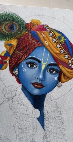 a drawing of a woman's face painted in blue and yellow with feathers on her head