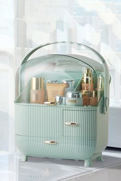 a green container filled with lots of beauty products