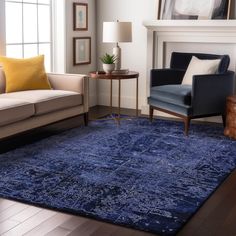 a living room with a couch, chair and rug