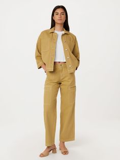 The Annie pants feature a loose fit, mid-rise, and full-length legs. Loose through the hips. Straight from knee to leg opening. Welt cargo-inspired pockets on the sides with contrast utility topstitches. Two slash pockets. Patch pockets at the back. Shank button at the front closure. Inseam: 31.5". Made with a blend of Jumpsuit Skirt, Shank Button, Denim Accessories, Minimalist Wardrobe, Loose Pants, Denim Pant, Sweater Jacket, Denim Pants, Tank Shirt