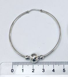 "Simple and classic Cape Cod style round solid sterling silver hoop earring ball beads. I assemble this earring with two 5mm and one 10mm sterling silver bead finish it with a 53mm endless hoop. Hoop dimension: 54mm (2 1/8\") hoop tube thickness: 2mm (3/32\") Bead size: 2 x 5mm and 1 x 10mm Quantity: 1 pair = 2 pieces stamped: 925 (marking of sterling silver) This earrings will send with a gift box. We are not affiliated with Eden Hand Art of Dennis, MA, the creator of the Cape Cod Jewelry." Hypoallergenic Sterling Silver Hoop Earrings With Round Beads, Hypoallergenic Silver Hoop Earrings, Silver Cape, Cape Cod Jewelry, Silver Hoop Earring, Harmony Ball, Locket Ring, Cape Cod Style, Earring Hoop